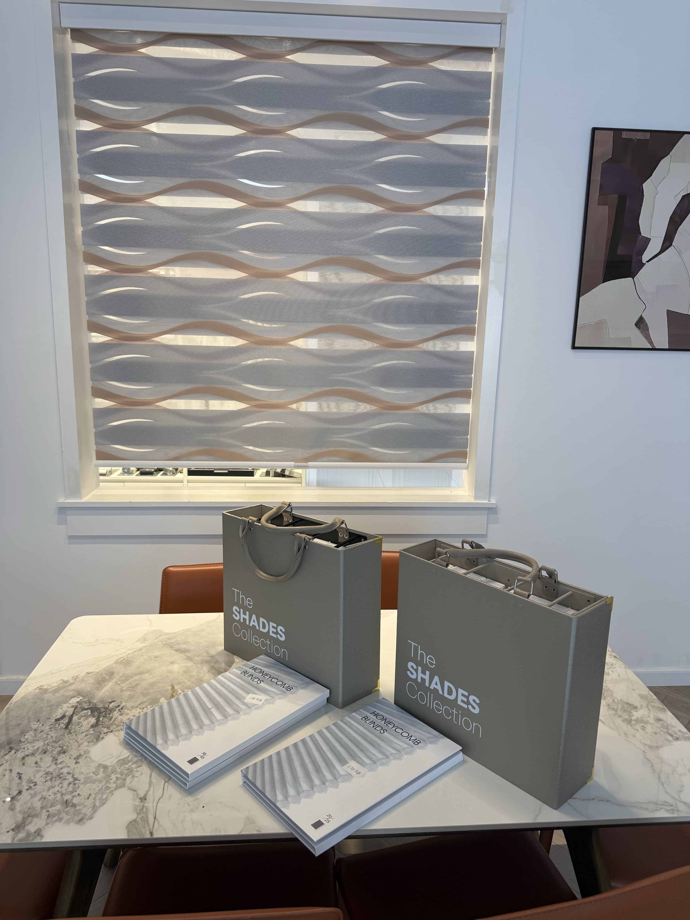 Window coverings and four fabric sample books in our showroom